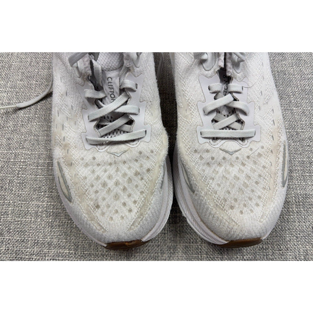 Second Half Supply Co, LLC women's white HOKA Clifton 9 running shoes with visible wear and knit upper texture