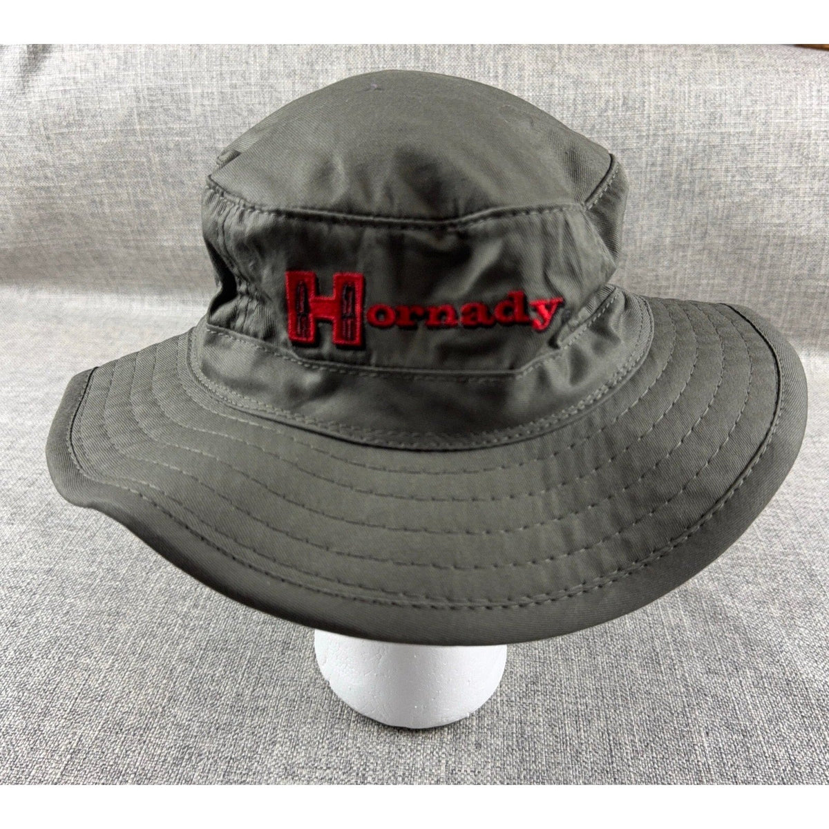 Second Half Supply Co, LLC dark gray Hornady boonie bucket hat with red embroidered logo and wide stitched brim