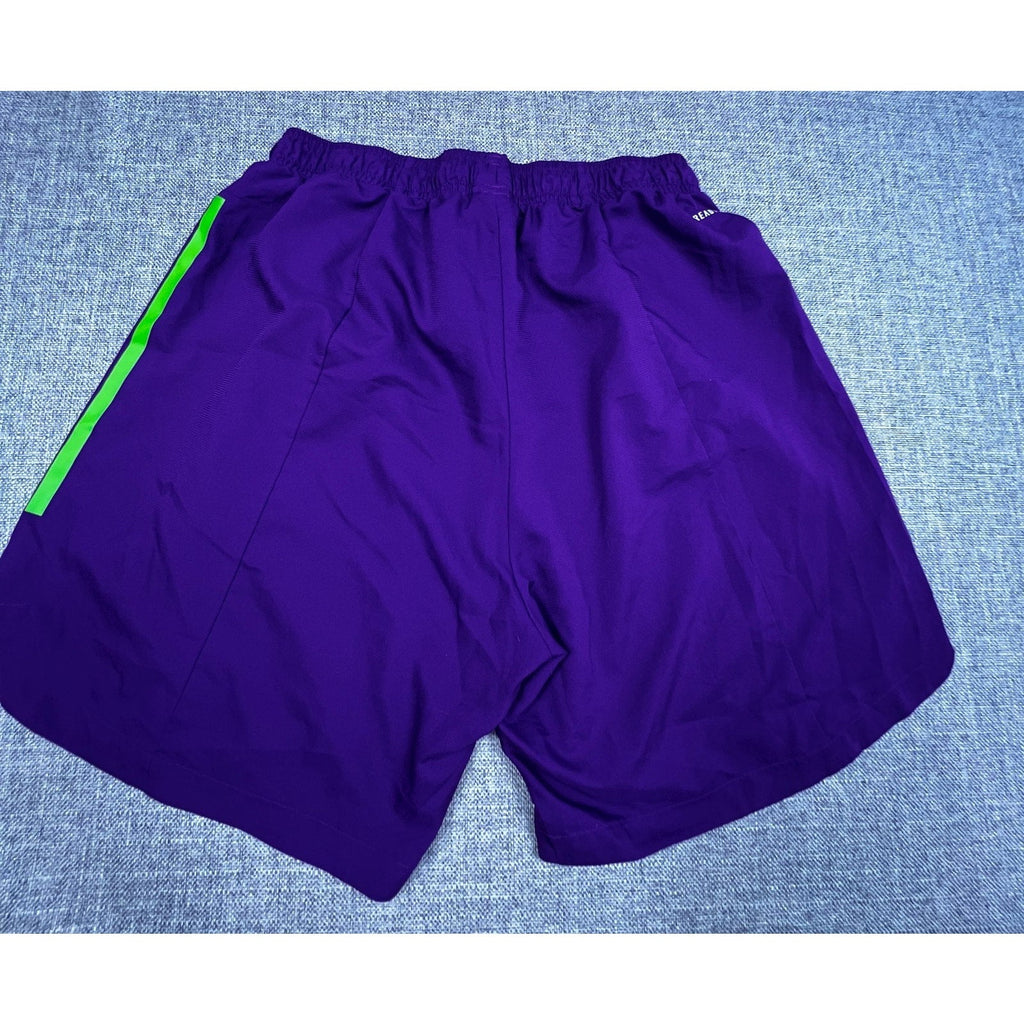 Second Half Supply Co, LLC purple Houston Dynamo soccer shorts with neon green side stripes and elastic waistband