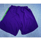 Second Half Supply Co, LLC purple Houston Dynamo soccer shorts with neon green side stripes and elastic waistband