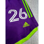 Second Half Supply Co, LLC purple and neon green Houston Dynamo Adidas soccer shorts with number 26 and logo detail