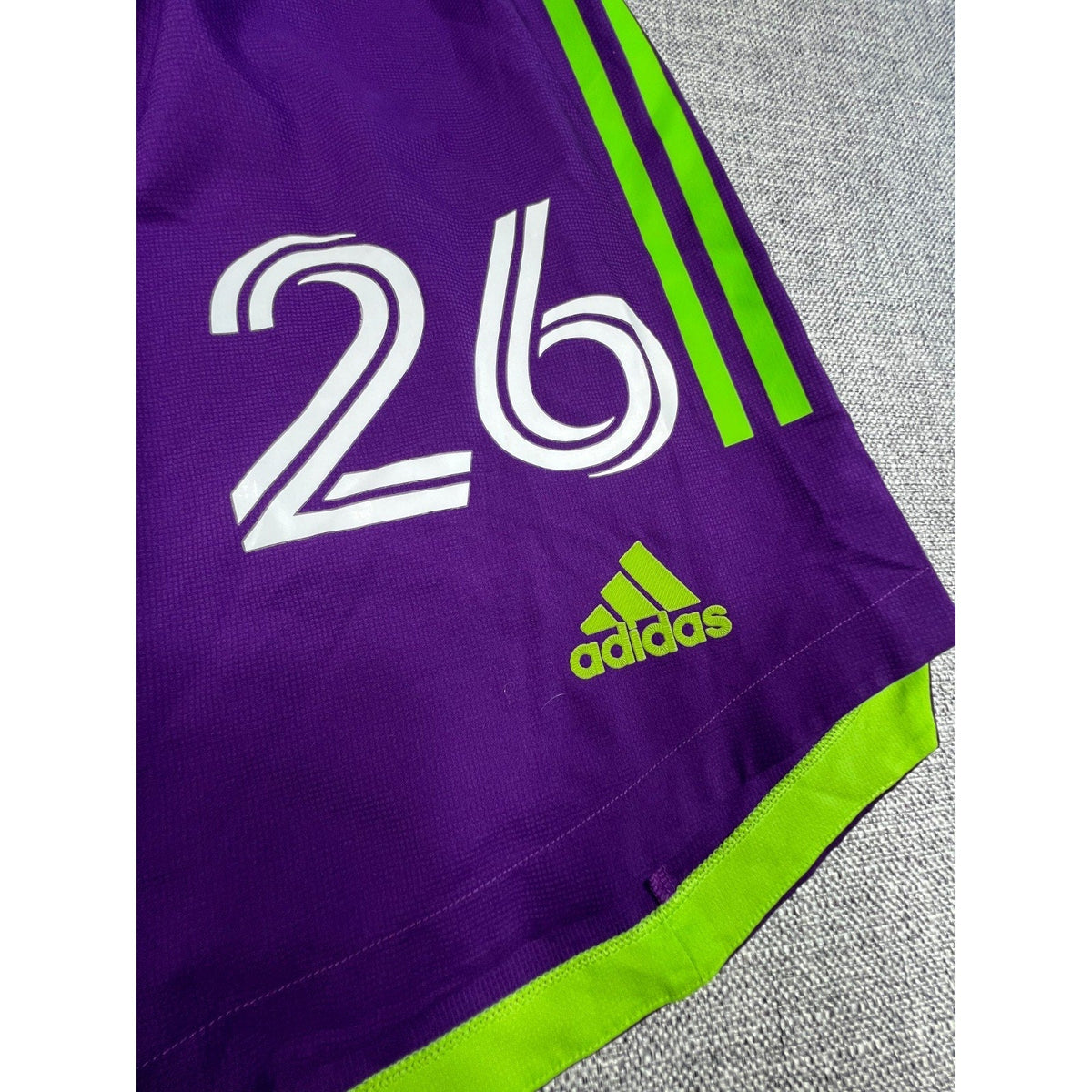 Second Half Supply Co, LLC purple and neon green Houston Dynamo Adidas soccer shorts with number 26 and logo detail