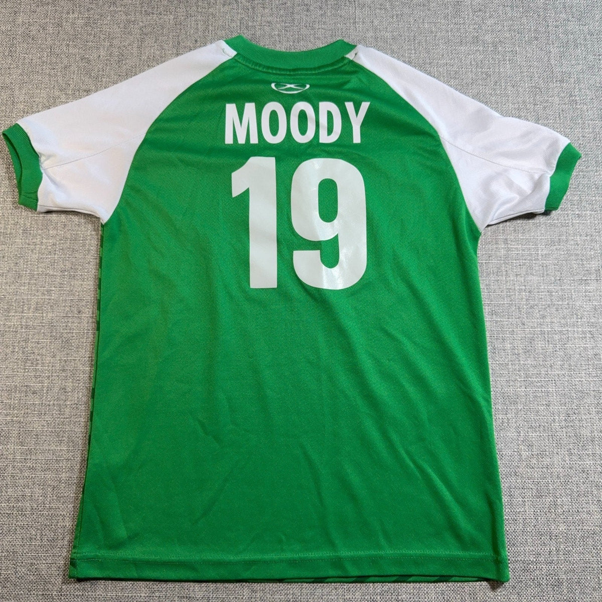 Second Half Supply Co, LLC youth Ireland soccer fan jersey in green and white with Moody 19 printed on the back