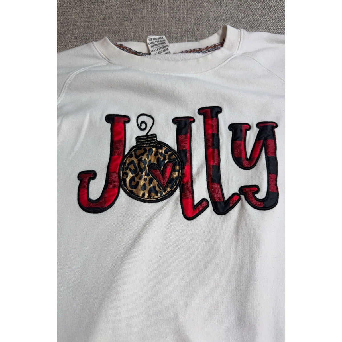 Second Half Supply Co, LLC ivory Christmas sweatshirt with Jolly appliqué in buffalo plaid and leopard print