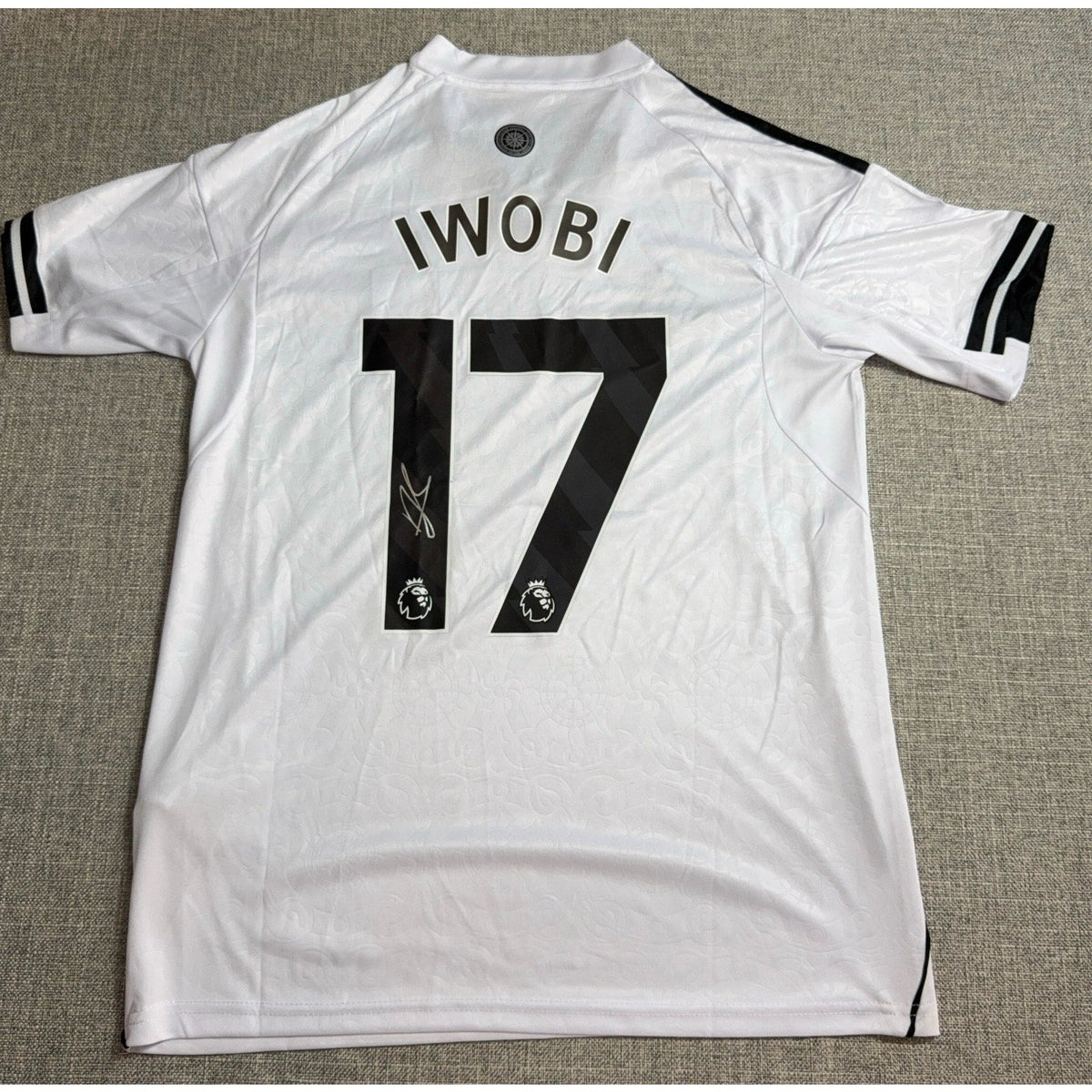 Second Half Supply Co, LLC signed Alex Iwobi Fulham 2025/26 home jersey, white and black with number 17 on back.
