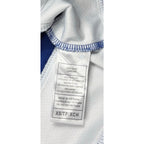 Second Half Supply Co, LLC tag showing 100% polyester material and size XS on a Tampa Bay Lightning jersey