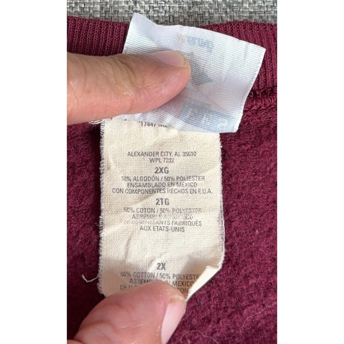 Second Half Supply Co, LLC vintage Jerzees sweatshirt size 2XL clothing tag on burgundy fleece fabric