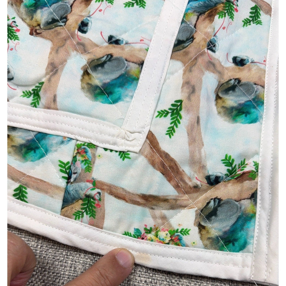 Second Half Supply Co, LLC handmade quilted vest with watercolor koala and floral print and white contrast binding