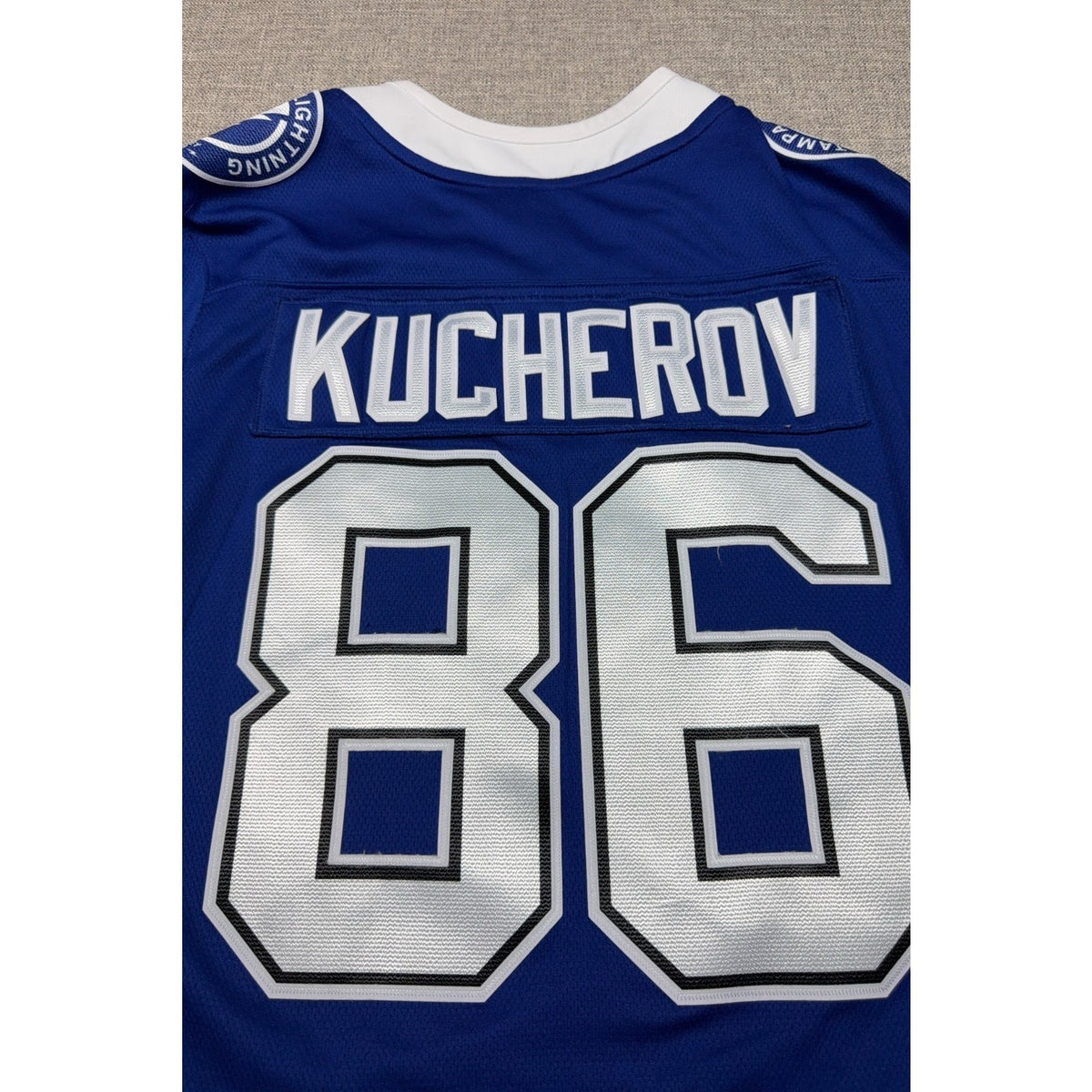 Second Half Supply Co, LLC blue Tampa Bay Lightning Kucherov #86 hockey jersey back view with name and number