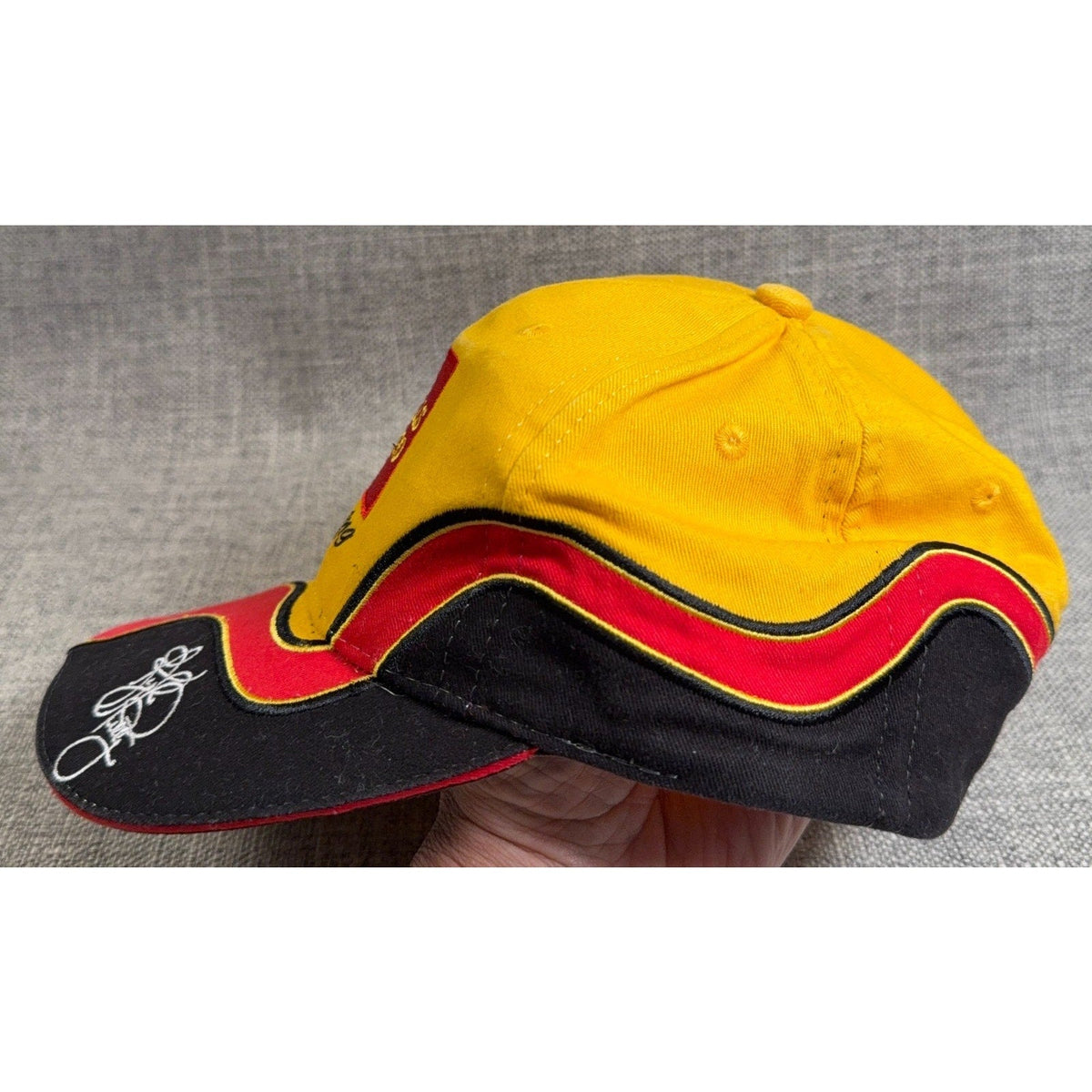 Second Half Supply Co, LLC vintage Kyle Petty #45 Wells Fargo NASCAR hat in yellow, red, and black with wave panels.