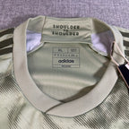 Second Half Supply Co, LLC Adidas LAFC 2023 away jersey collar detail with Shoulder to Shoulder text in green