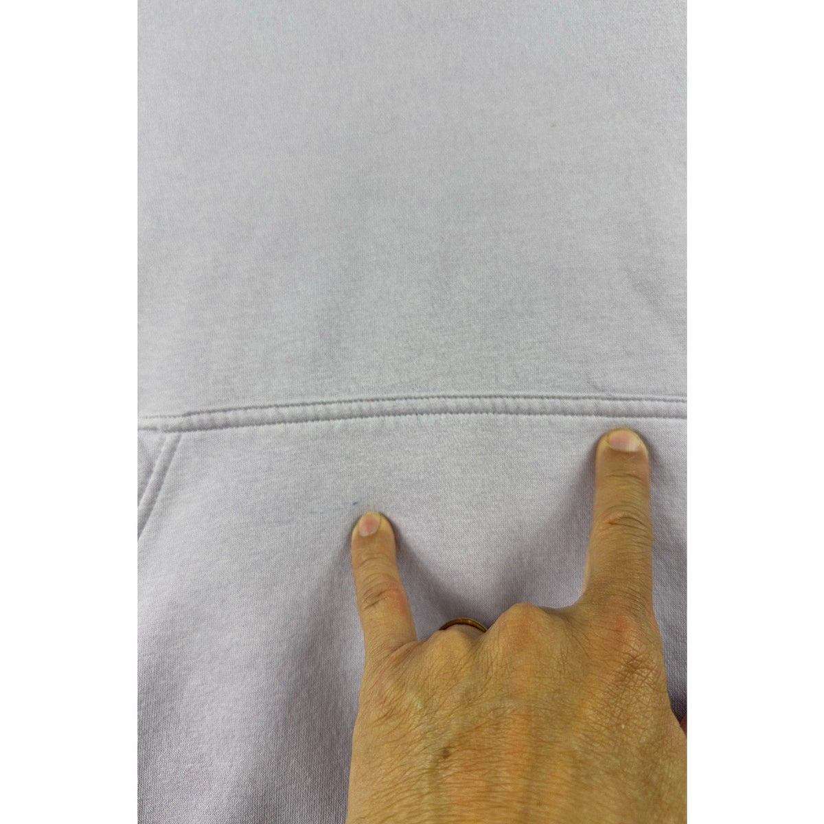Second Half Supply Co, LLC lavender hoodie showing a small mark near the front kangaroo pocket