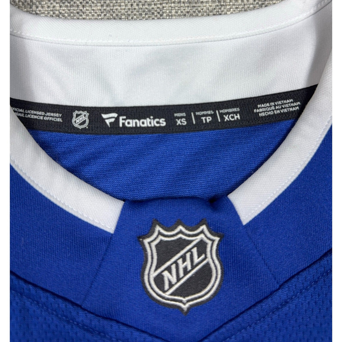 Second Half Supply Co, LLC Fanatics Tampa Bay Lightning jersey collar tag showing size XS and NHL logo