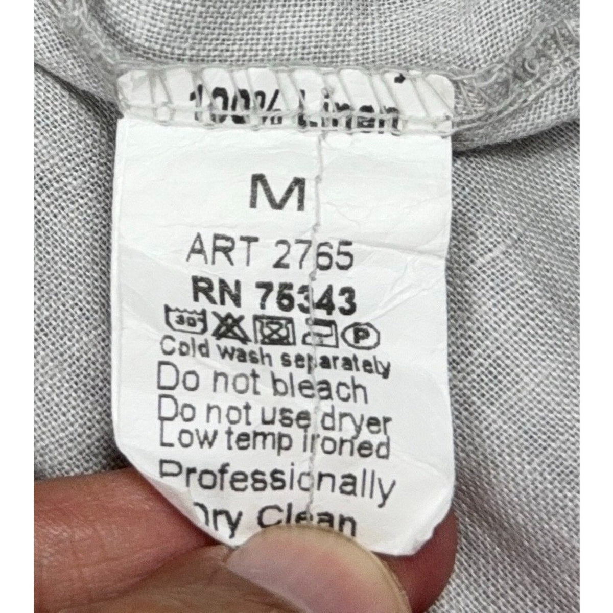 Second Half Supply Co, LLC Terzo Millennio linen dress care label showing 100% linen material and washing instructions