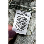 Second Half Supply Co, LLC garment care label showing 55% linen and 45% lyocell fabric blend and washing instructions.