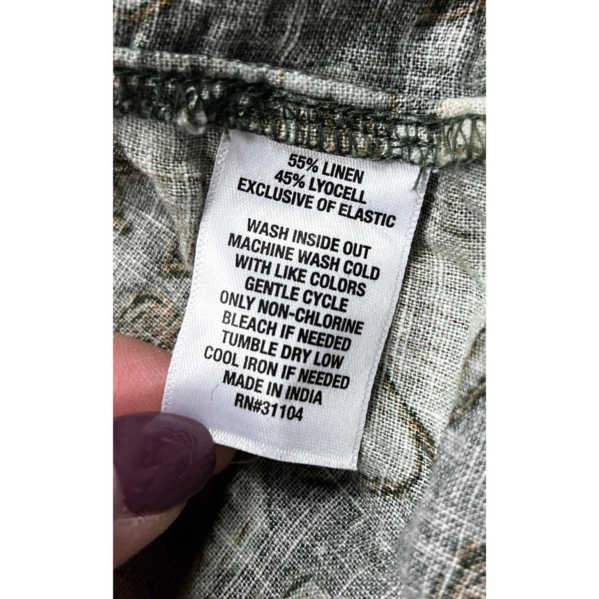 Second Half Supply Co, LLC garment care label showing 55% linen and 45% lyocell fabric blend and washing instructions.