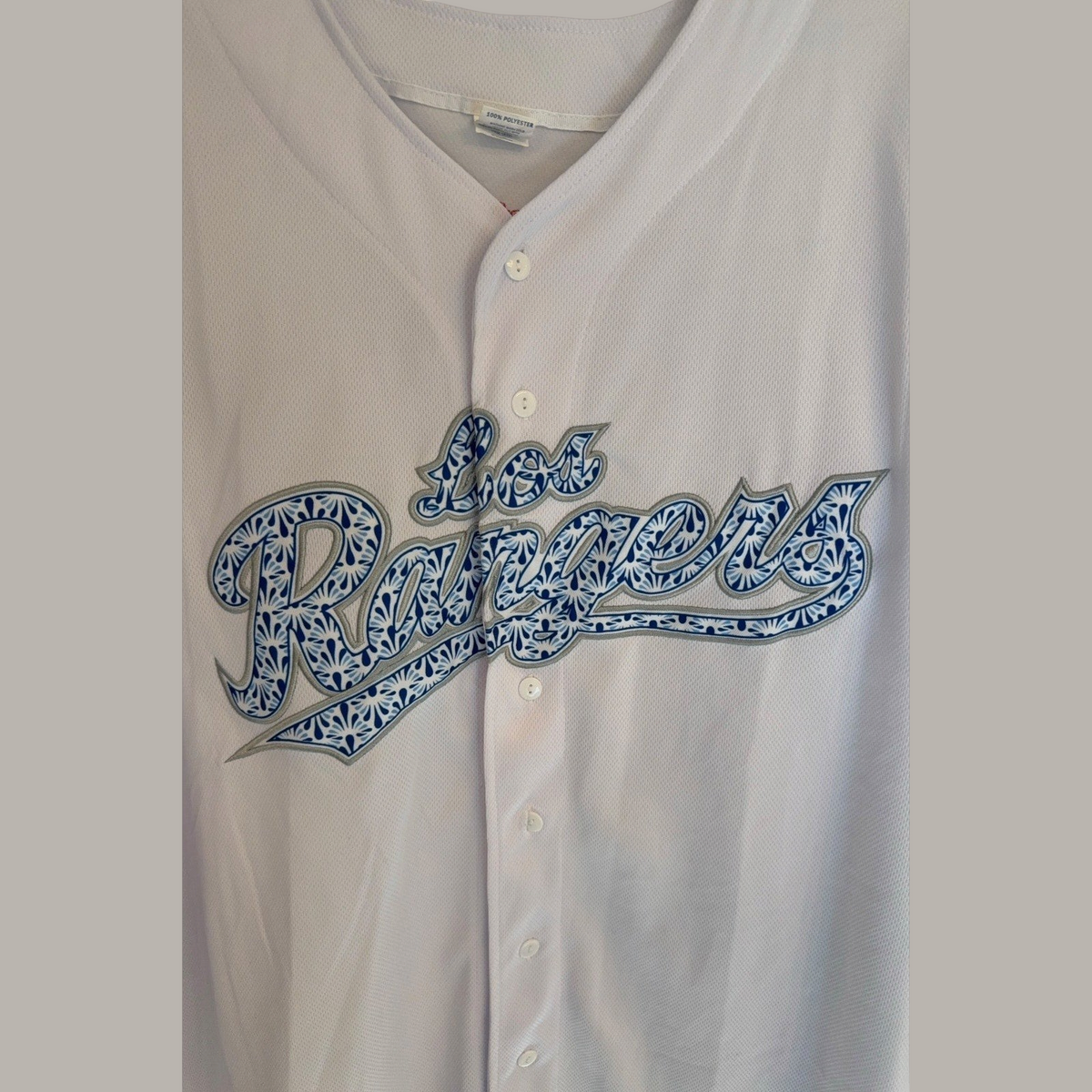 Second Half Supply Co, LLC white mesh Texas Rangers Los Rangers baseball jersey with blue Talavera-style chest script