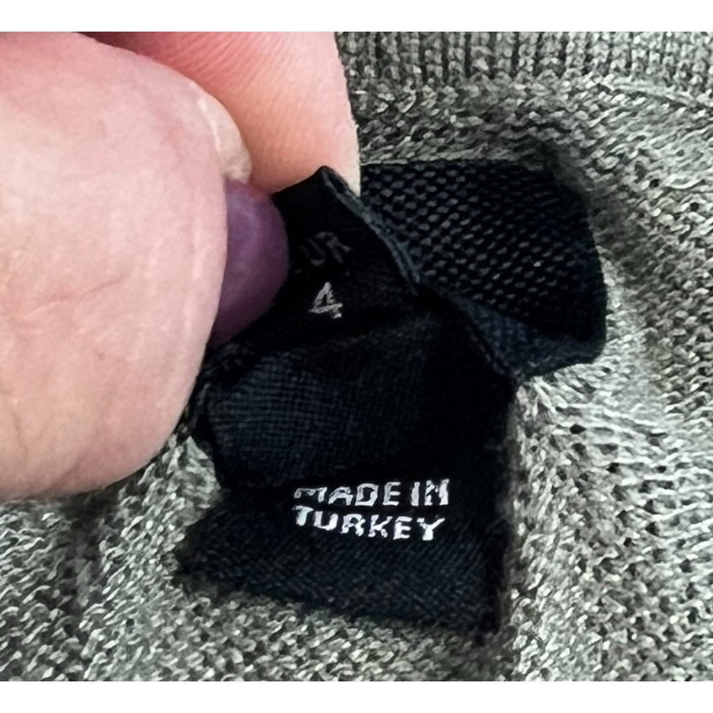 Second Half Supply Co, LLC clothing tag showing Made in Turkey origin on a textured grey fabric garment