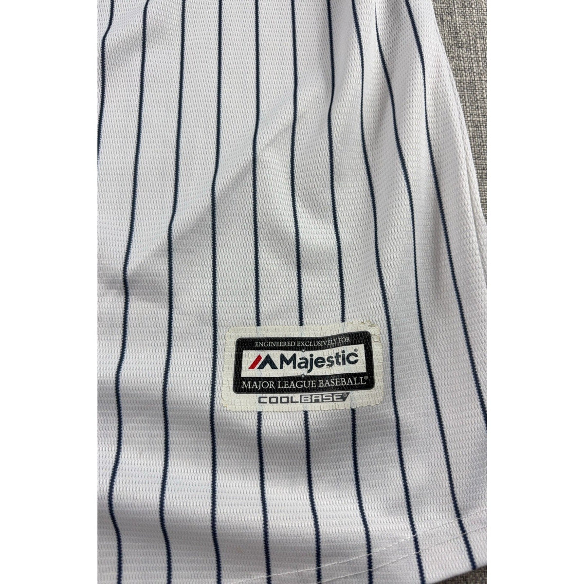 Second Half Supply Co, LLC Majestic Cool Base white baseball jersey with navy pinstripes and official brand patch