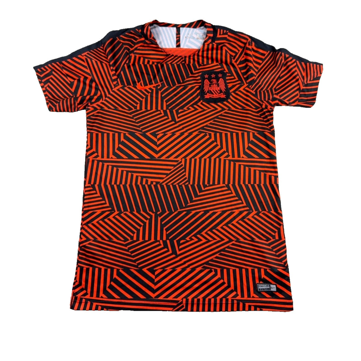 Second Half Supply Co, LLC Manchester City Nike Dri-FIT soccer shirt in red and black with geometric pattern