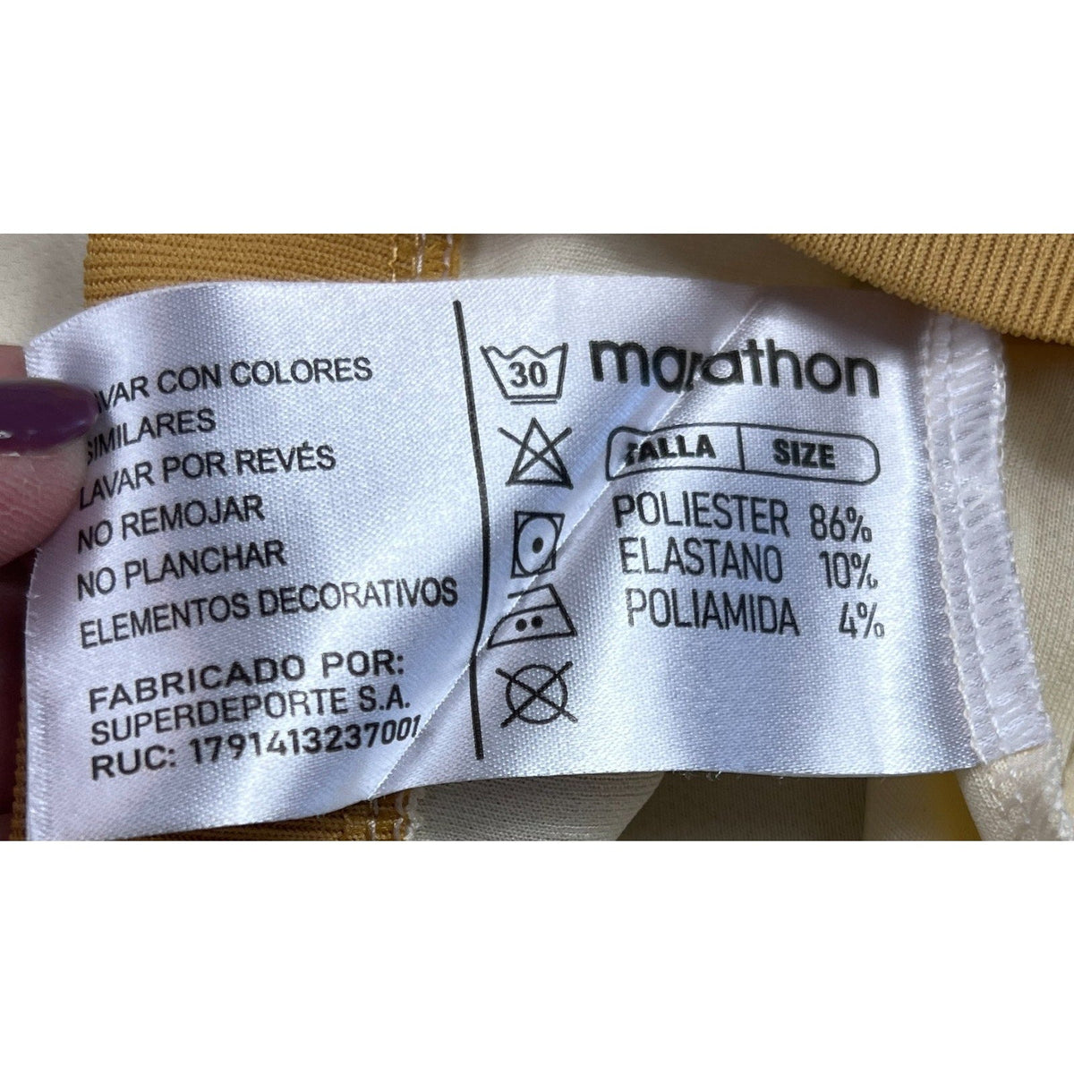 Second Half Supply Co, LLC Marathon jersey care label showing fabric composition of polyester, elastane, and polyamide