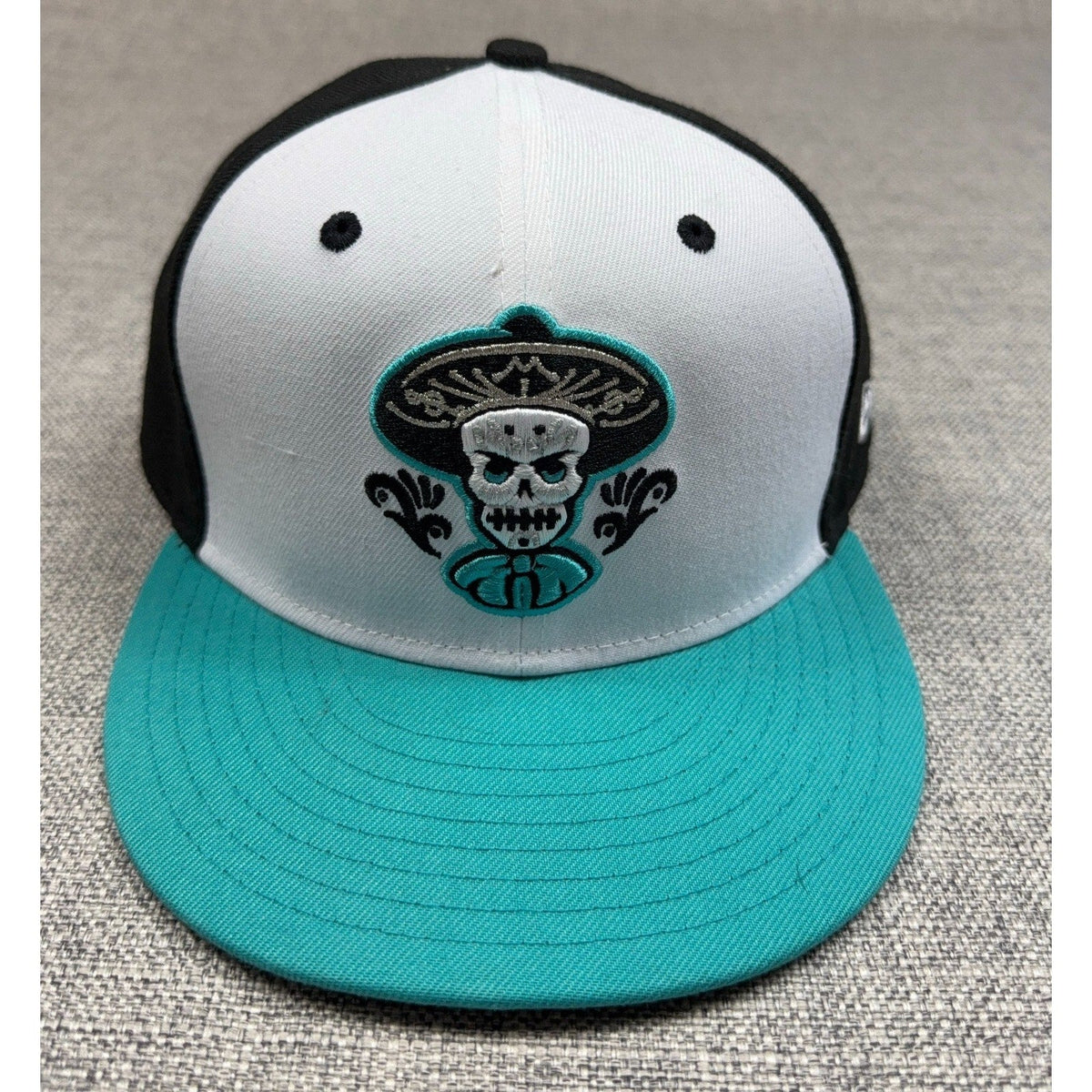 Second Half Supply Co, LLC New Era 59FIFTY Albuquerque Isotopes Mariachis fitted hat with sugar skull embroidery.