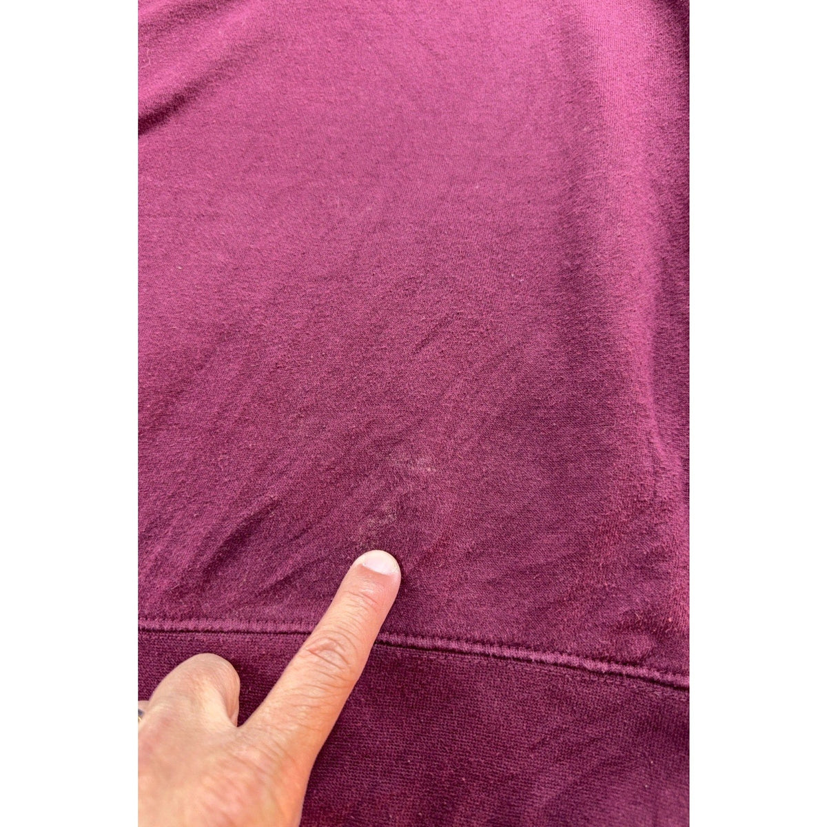 Second Half Supply Co, LLC maroon Texas A&M Aggies sweatshirt showing a small fabric mark on the garment