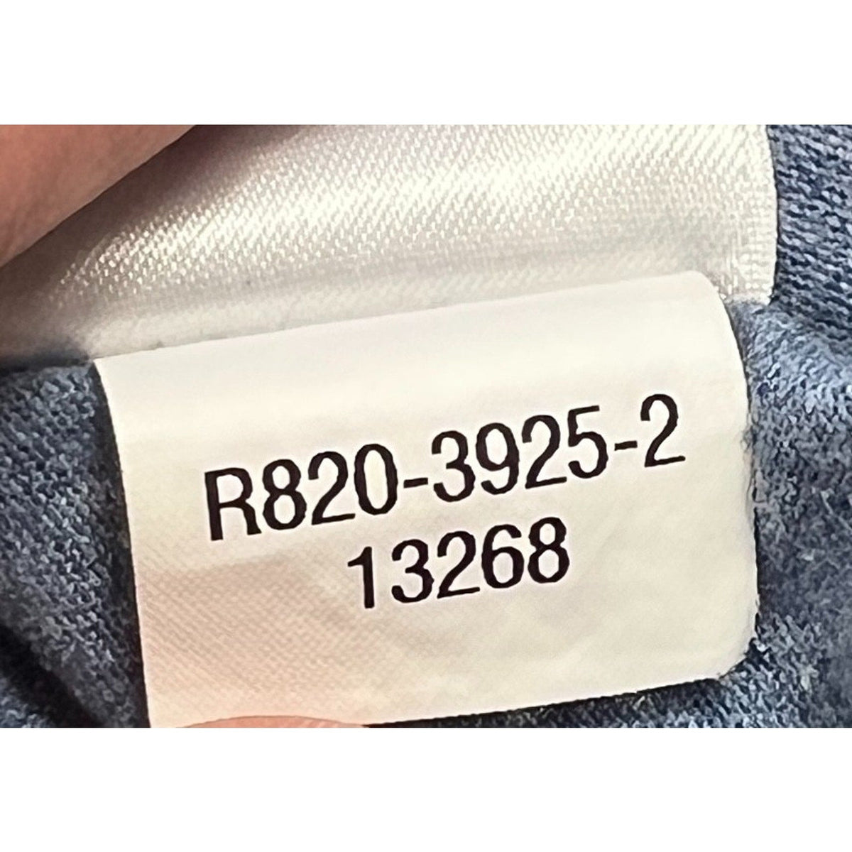 Second Half Supply Co, LLC tag detail showing style number R820-3925-2 on a heather gray Mickey Mouse ringer T-shirt