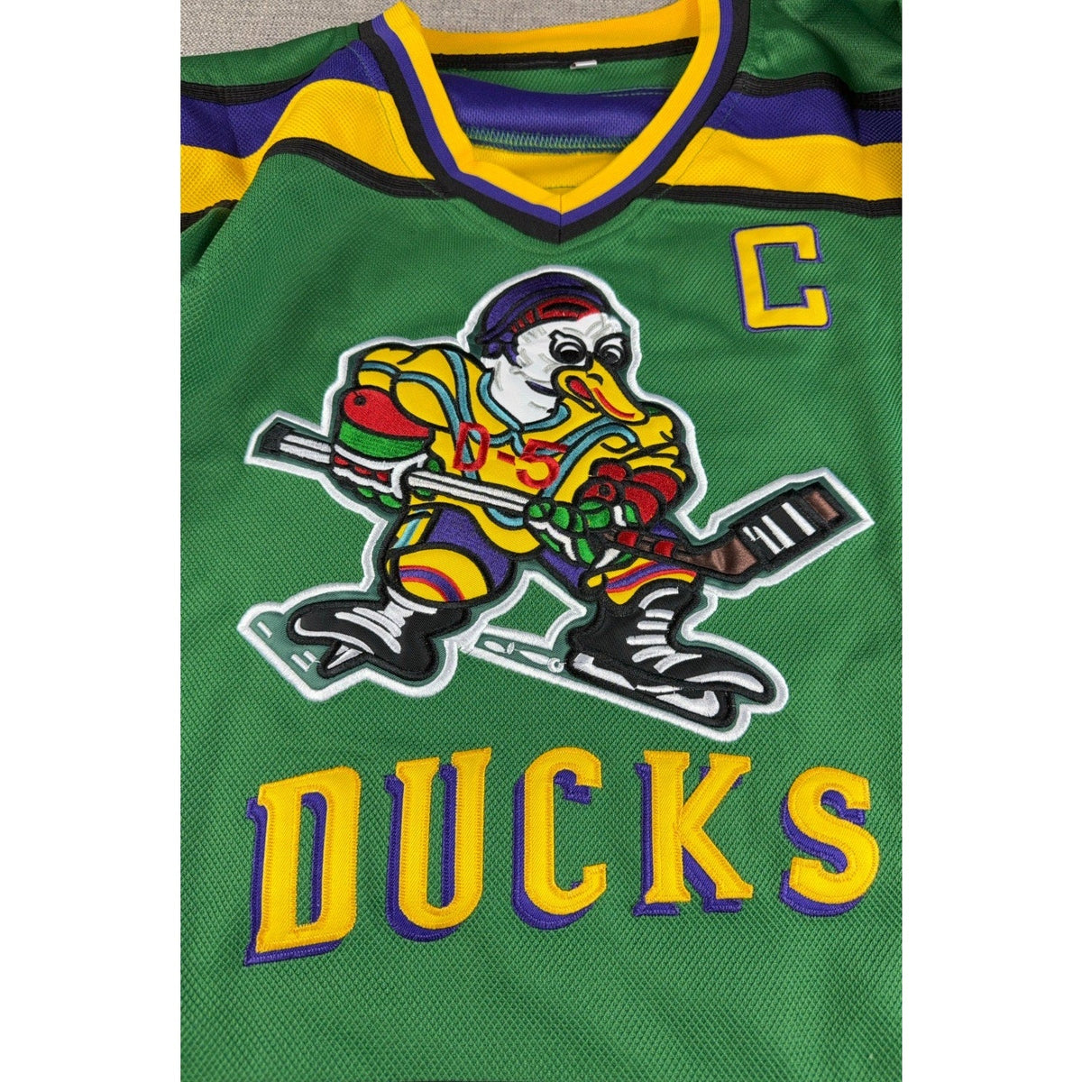 Second Half Supply Co, LLC green Mighty Ducks Charlie Conway #96 hockey jersey with embroidered duck graphic and logo