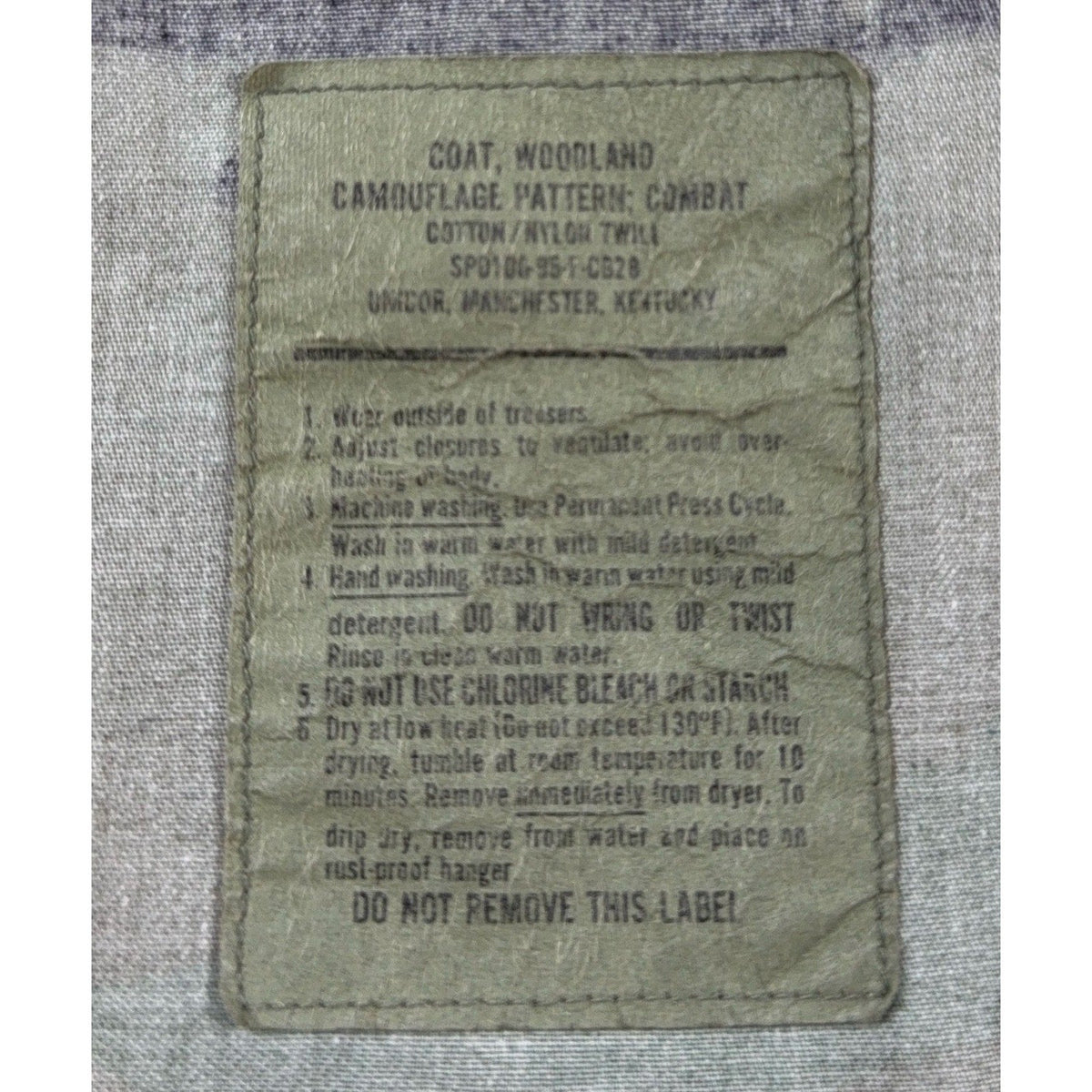 Second Half Supply Co, LLC vintage 1993 USGI M81 woodland camo BDU combat coat military specification label