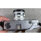 Second Half Supply Co, LLC vintage Minolta Hi-Matic 11 35mm rangefinder camera top view with silver metal body