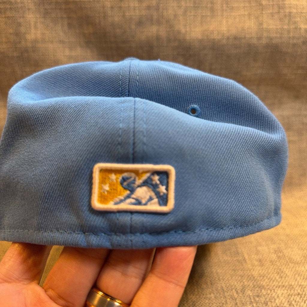Second Half Supply Co, LLC light blue Myrtle Beach Pelicans 59FIFTY fitted hat showing the rear MiLB batterman logo