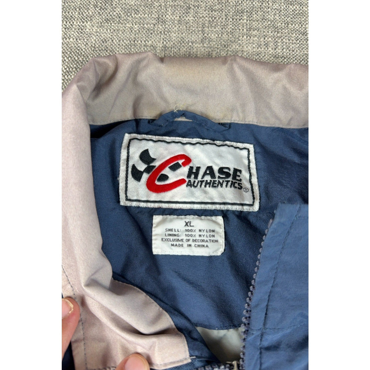 Second Half Supply Co, LLC vintage Chase Authentics NASCAR jacket label showing size XL and nylon material details