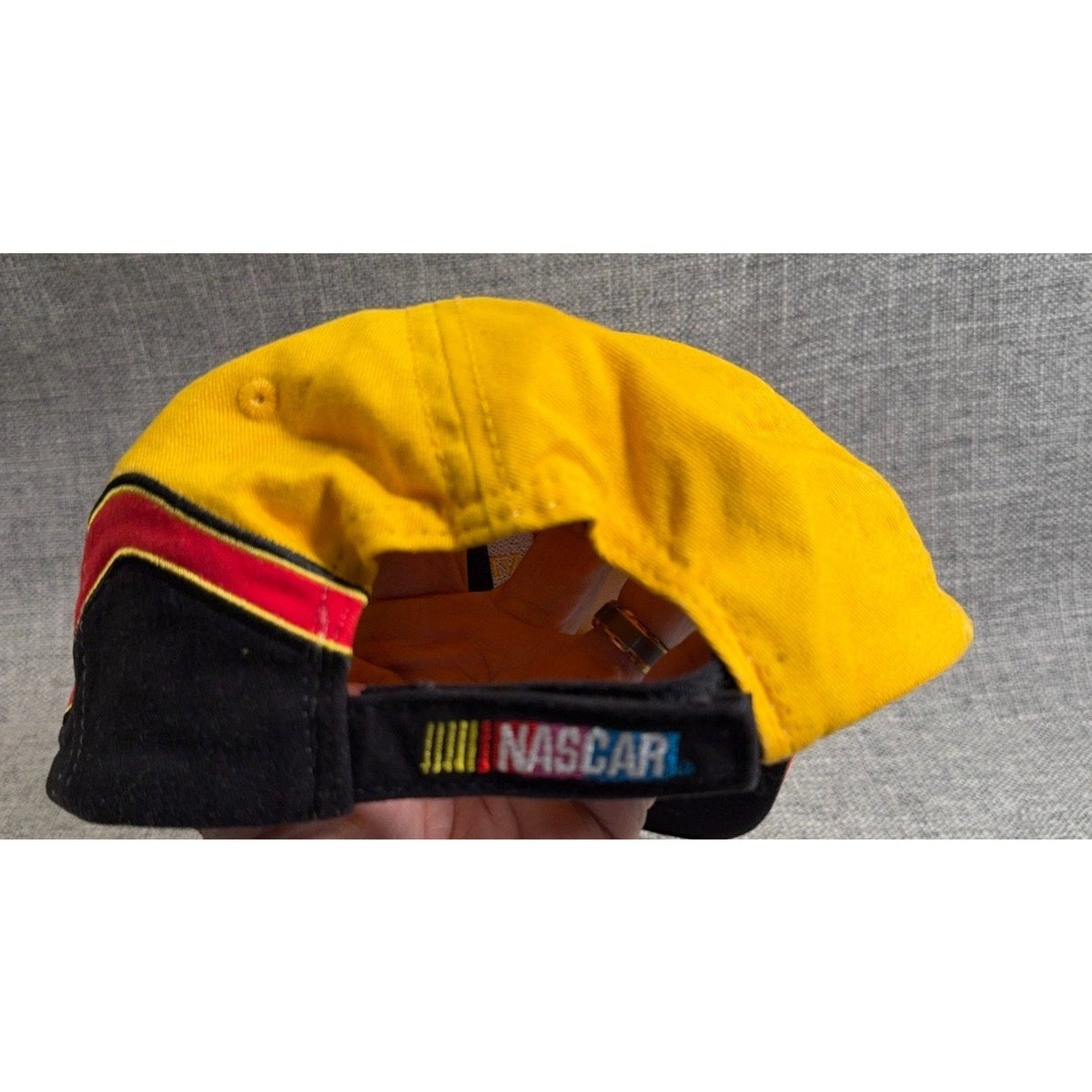 Second Half Supply Co, LLC vintage NASCAR hat featuring a yellow crown, black strapback, and NASCAR logo embroidery.