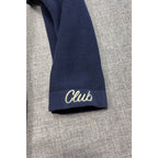 Second Half Supply Co, LLC navy knit cardigan sleeve with white embroidered Club script on the cuff