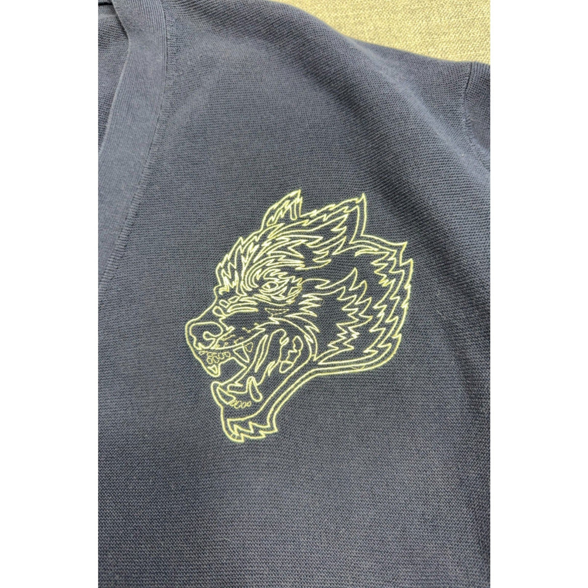 Second Half Supply Co, LLC navy knit cardigan featuring a detailed pale-yellow embroidered wolf head logo.