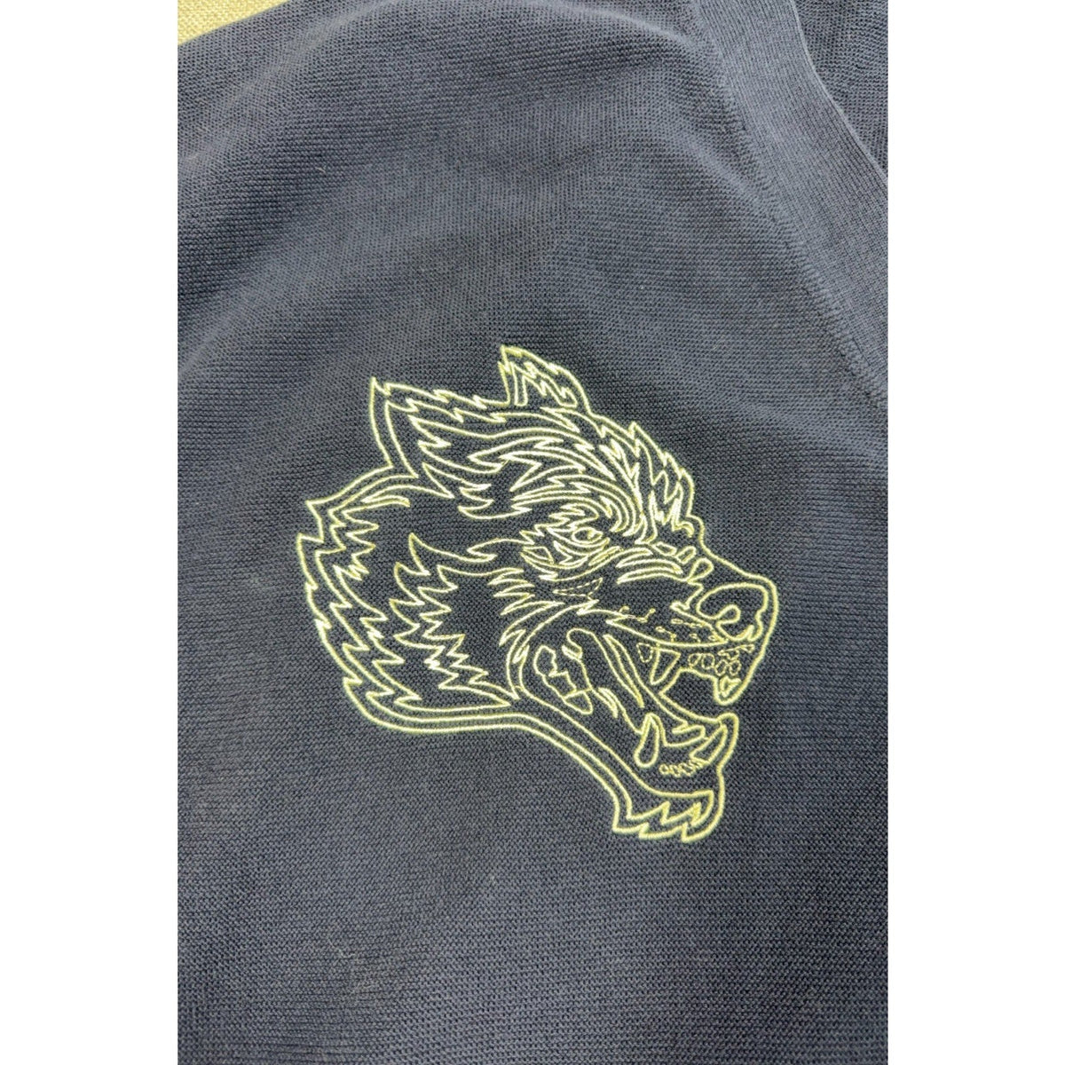 Second Half Supply Co, LLC navy knit cardigan featuring a detailed pale-yellow embroidered wolf head logo