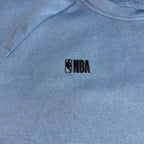 Second Half Supply Co, LLC blue crewneck sweatshirt featuring a small black NBA logo on the chest