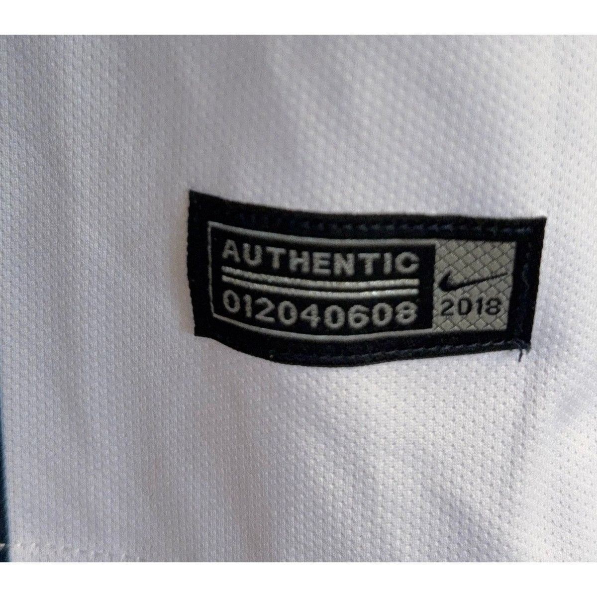 Second Half Supply Co, LLC authentic 2018 Nike Aeroswift soccer jersey tag detail on white performance fabric