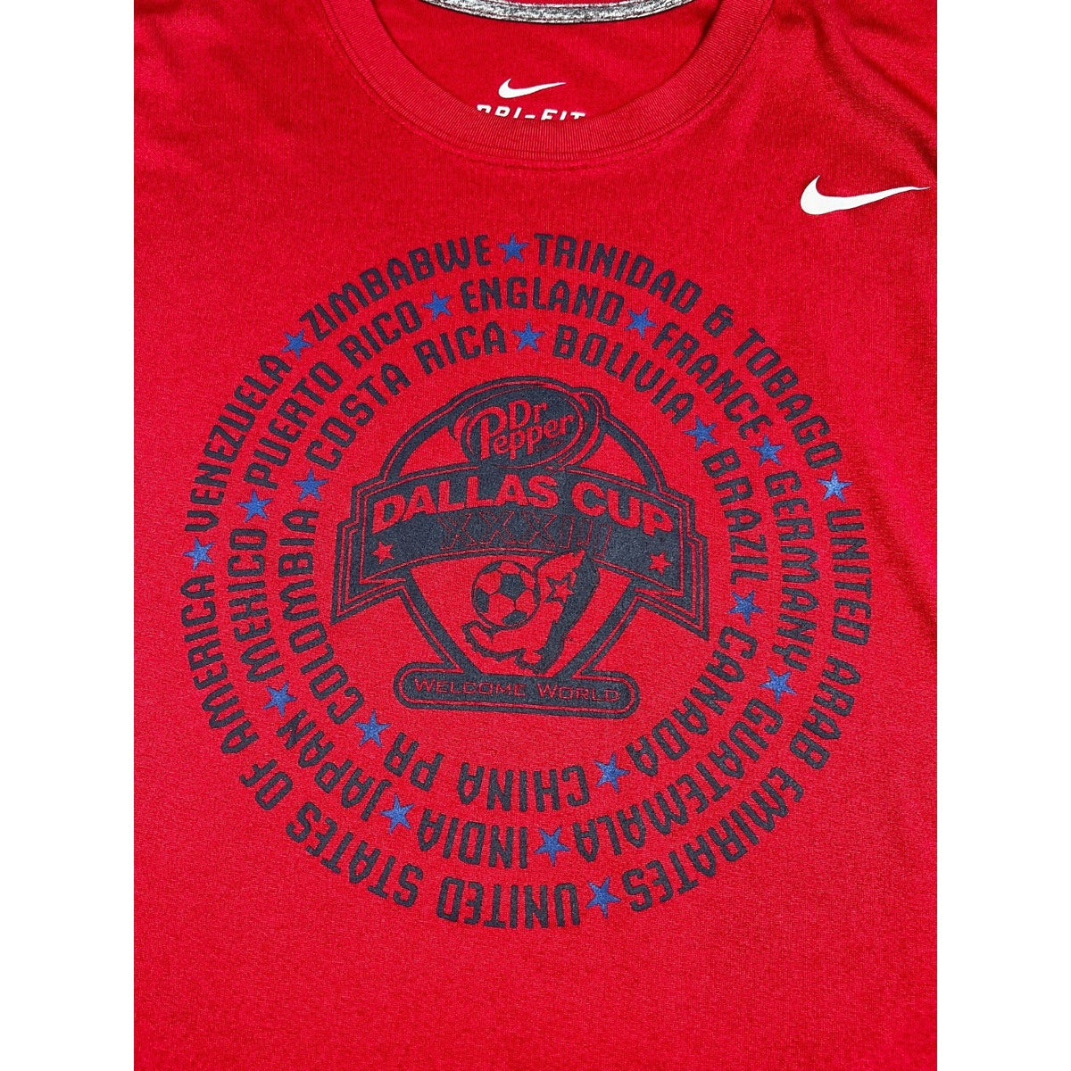 Second Half Supply Co, LLC red Nike Dri-FIT soccer shirt with 2012 Dr Pepper Dallas Cup graphic and country names