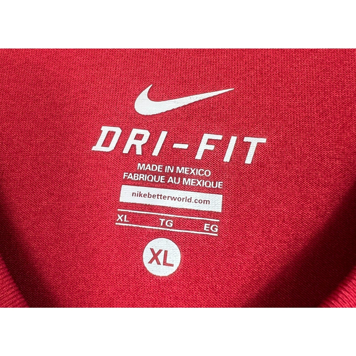 Second Half Supply Co, LLC Nike Dri-FIT red soccer shirt interior neck label showing size XL and branding details