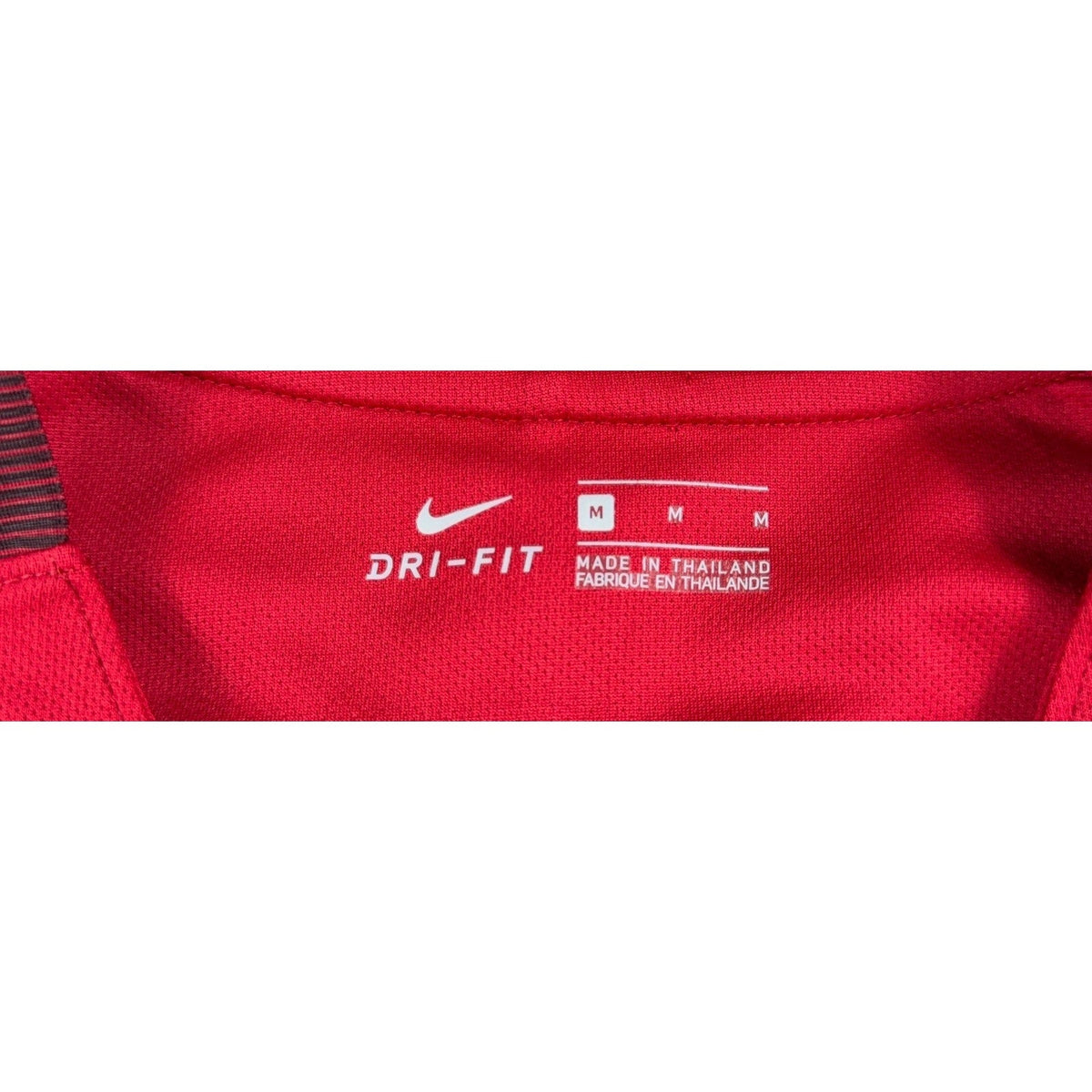 Second Half Supply Co, LLC Nike USMNT soccer jersey interior neck label showing size M and Dri-FIT branding