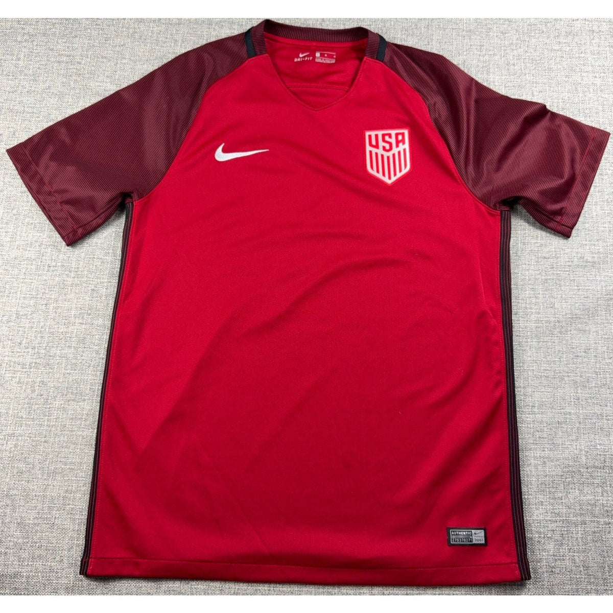 Second Half Supply Co, LLC red Nike USMNT soccer jersey with dark red raglan sleeves and USA crest in size medium.
