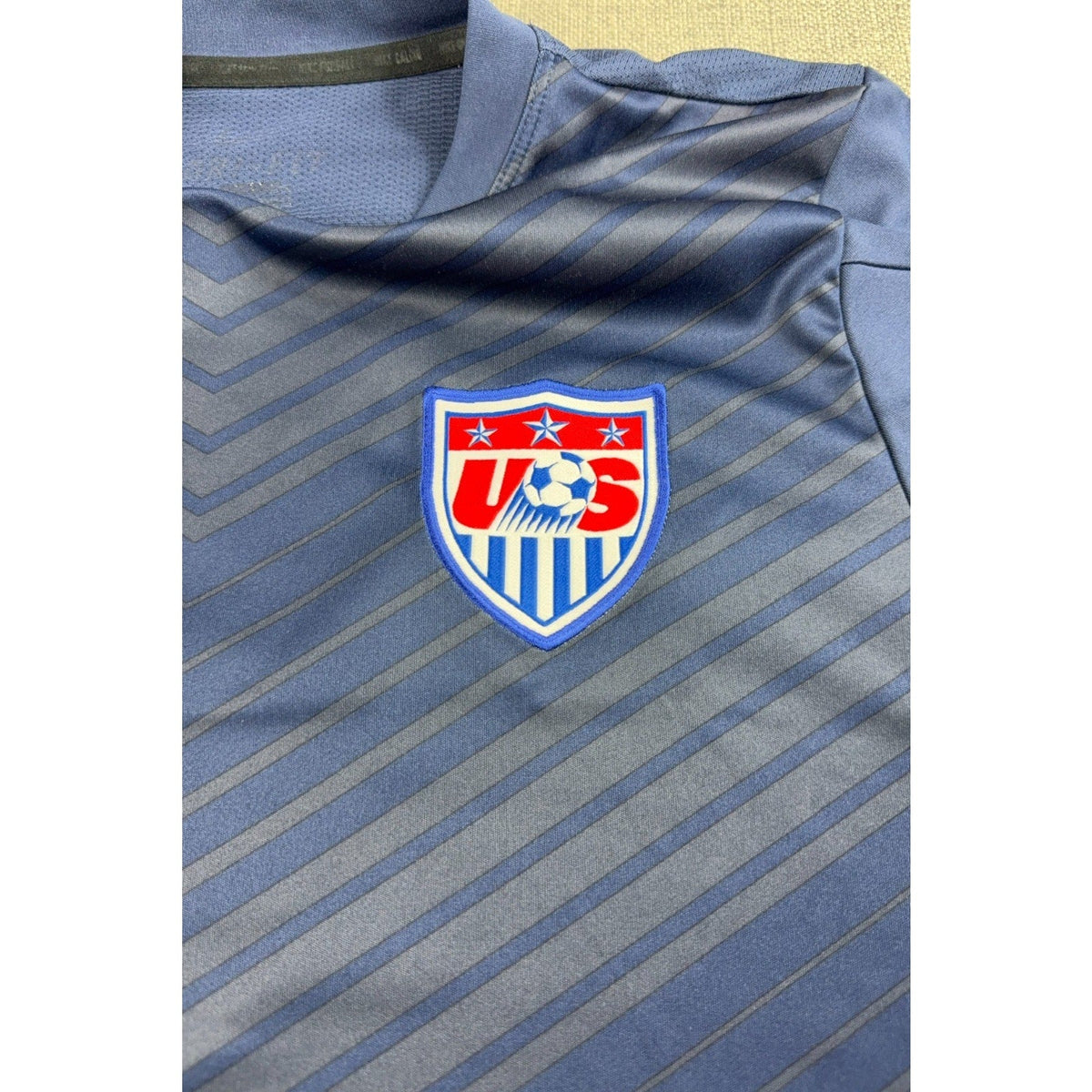 Second Half Supply Co, LLC navy blue Nike USMNT 2014 World Cup training jersey with embroidered USA soccer crest