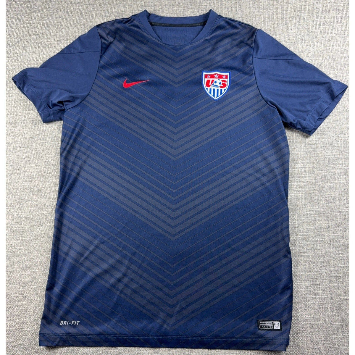 Second Half Supply Co, LLC navy blue Nike USMNT 2014 World Cup training jersey with tonal chevron pattern and USA crest
