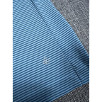 Second Half Supply Co, LLC NUX x Peloton blue and white microstripe workout tank with reflective logo detail