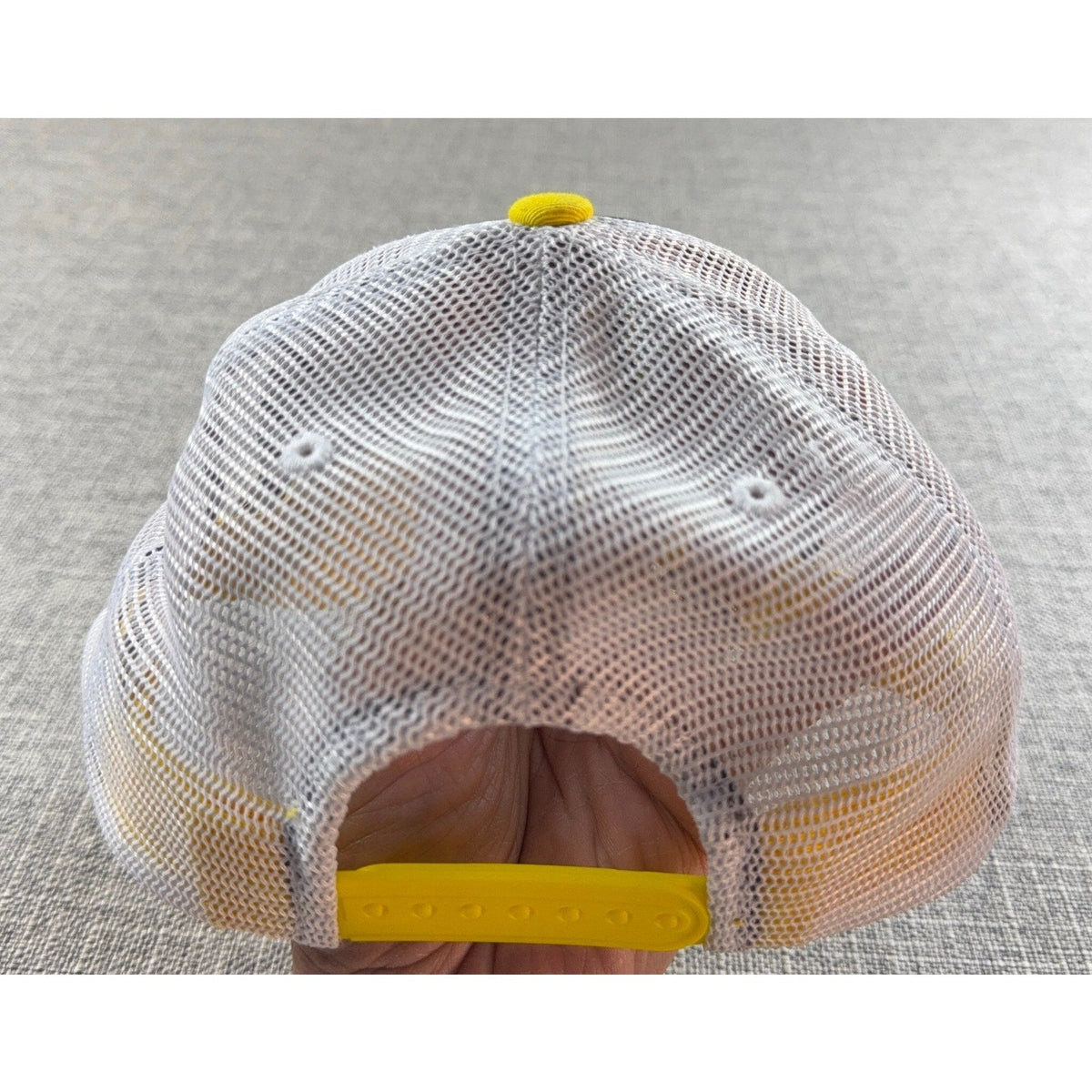 Second Half Supply Co, LLC Oregon Ducks trucker hat back view with white mesh, yellow snapback, and yellow button