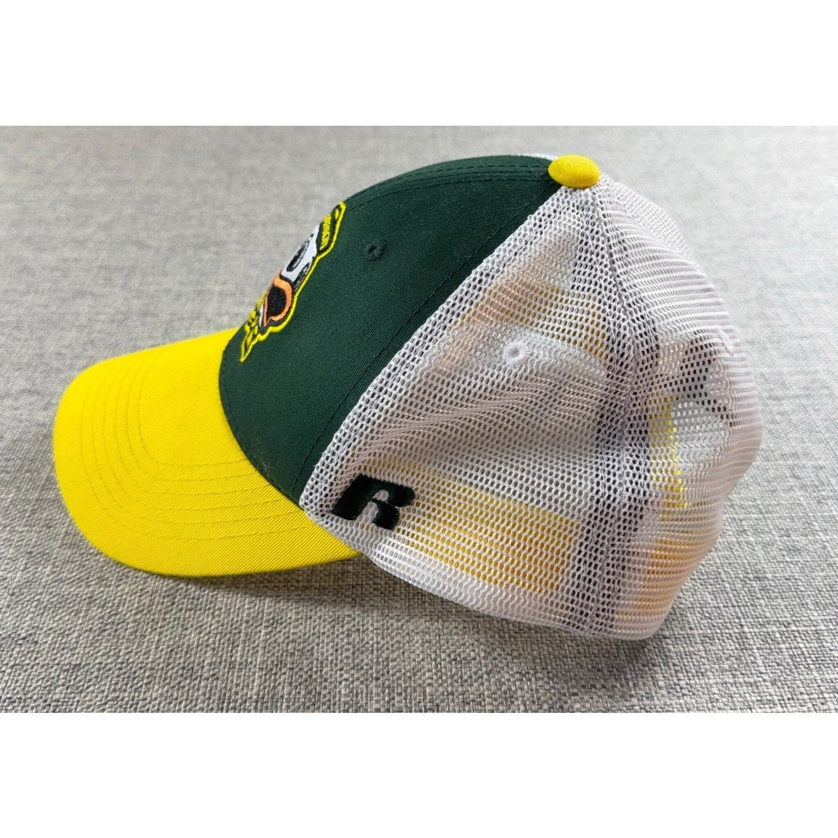 Second Half Supply Co, LLC Oregon Ducks trucker hat with green front, yellow bill, white mesh, and side R logo