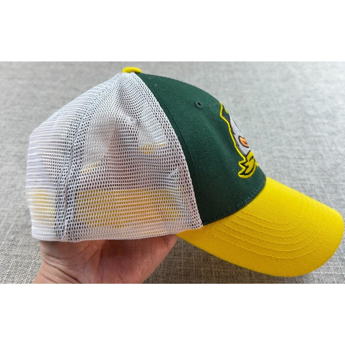 Second Half Supply Co, LLC Oregon Ducks trucker hat with green front, yellow bill, and white mesh back