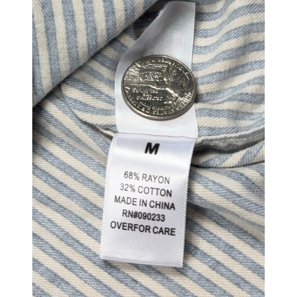 Second Half Supply Co, LLC PacSun shirt fabric care tag showing rayon cotton blend and size medium